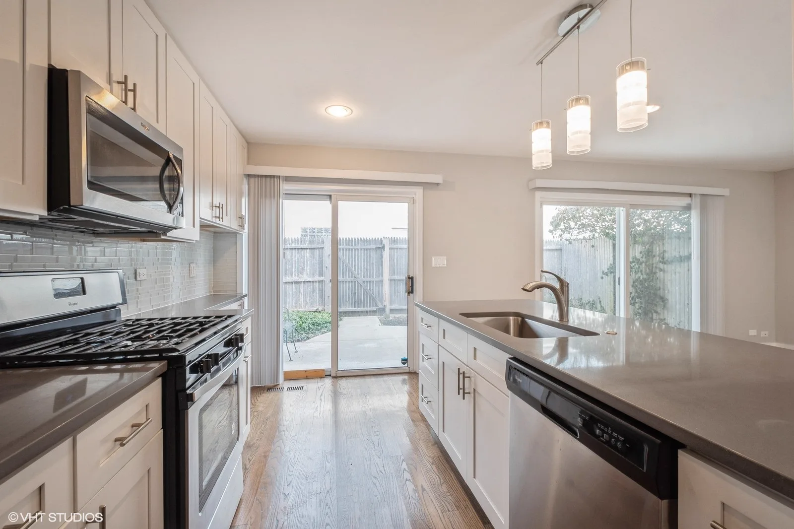 Kitchen with sliding door to the private backyard