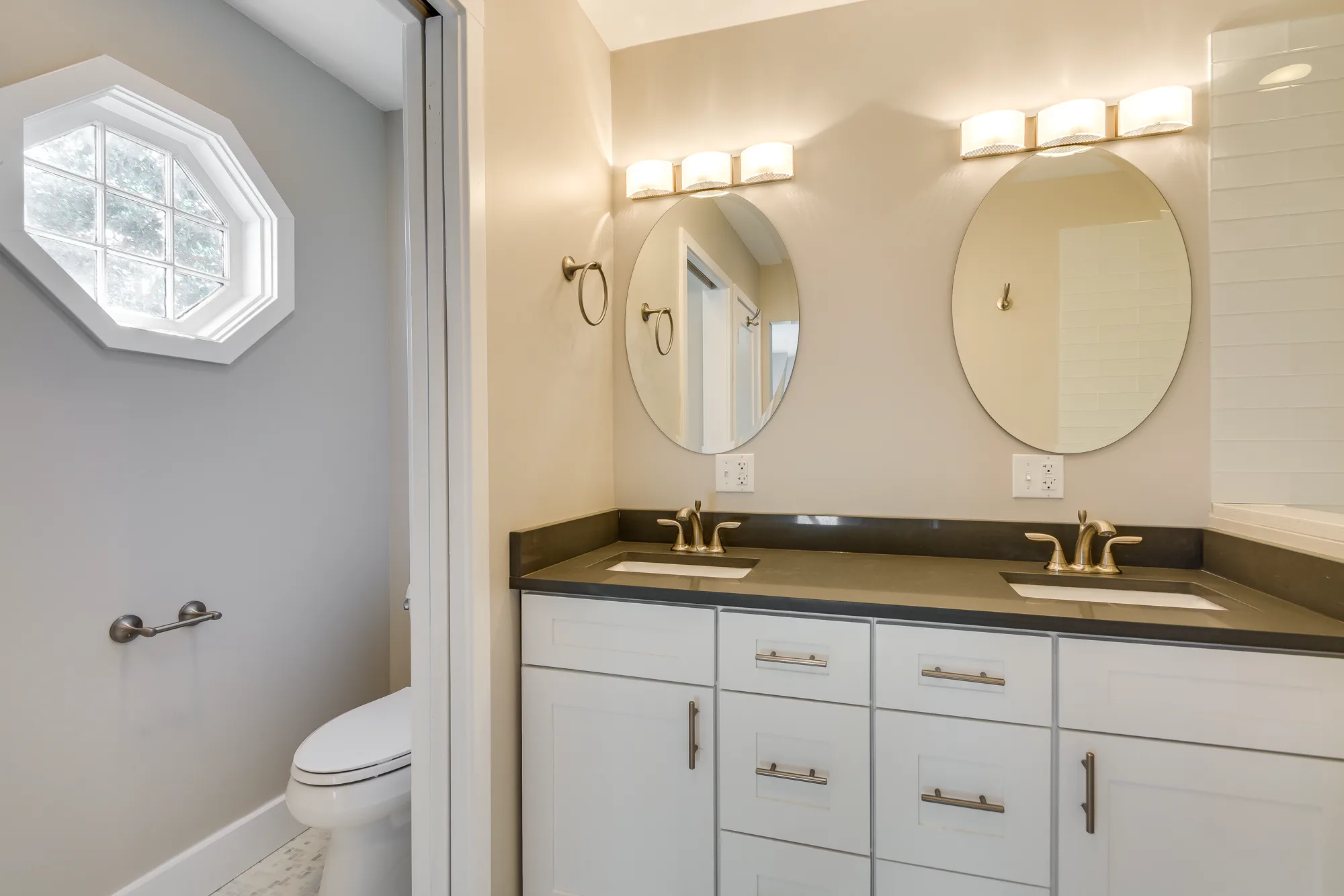 Bathroom with double vanity and quartz countertop